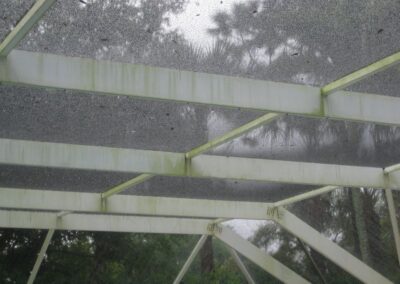 A metal structure with green paint on it.